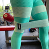 teal w8train hip band being used around legs